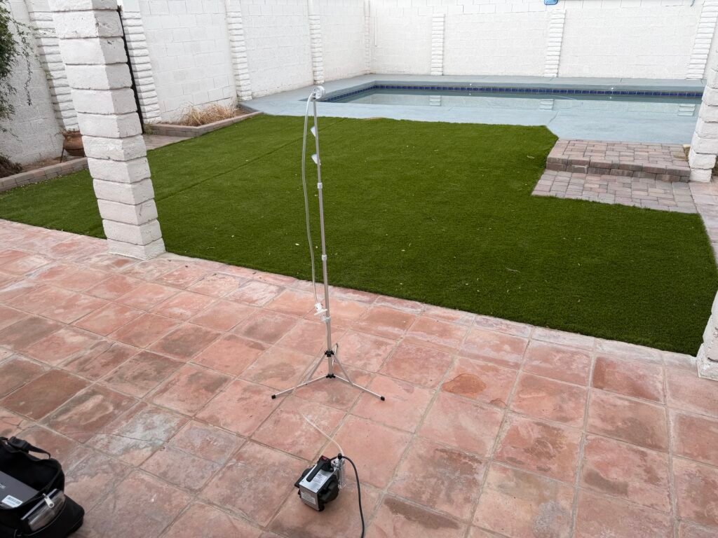 Mold Testing Phoenix AZ outdoor air sampling equipment collecting a control sample beside a residential pool